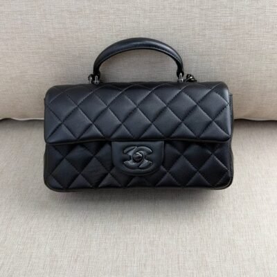 CHANEL Black Lambskin Mini Classic Handbag With Top Handle BHW